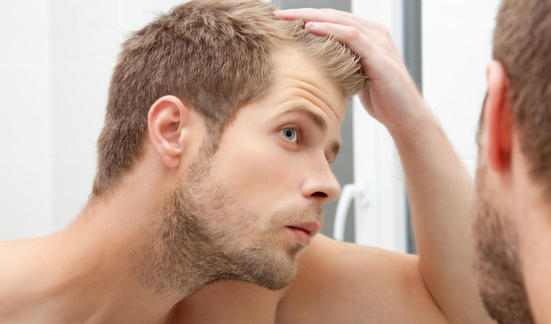 man looking into mirror