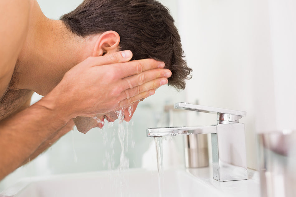 washing face in sink