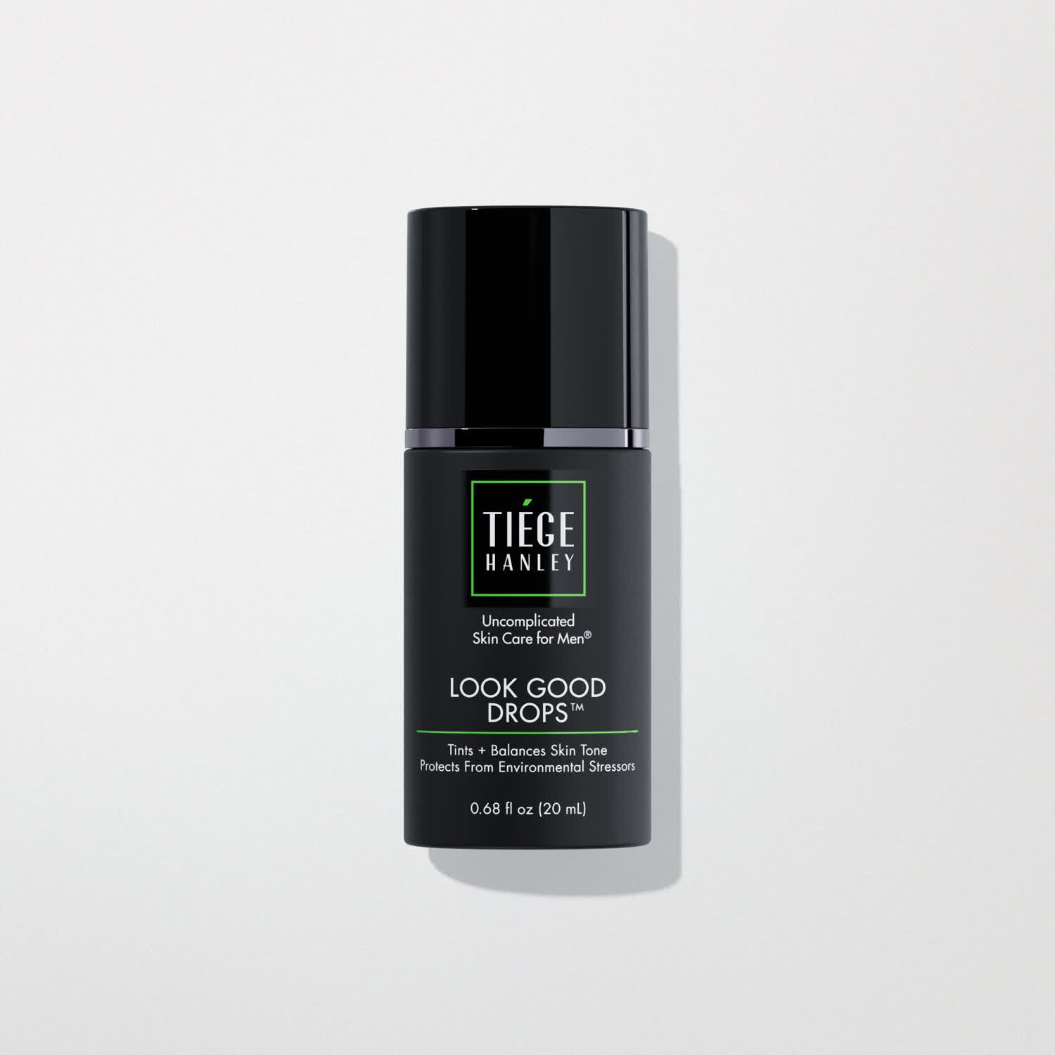 Skin care product bottle labeled 'Tiege Hanley Look Good Drops' on a light gray background