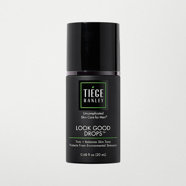 Skin care product bottle labeled 'Tiege Hanley Look Good Drops' on a light gray background
